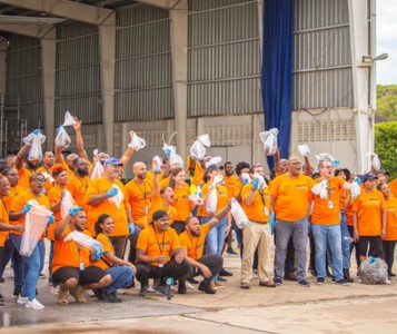 Employees of Curaçao National Airport wearing orange shirts at the safety, security and environmental awareness week